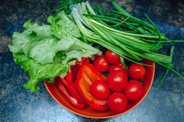 fresh tomatoes, pepper, onions and salad in a bowl