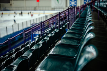 Naklejka premium Plastic seat spectator stands for the ice hockey stadium 
