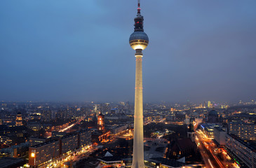 Aerial wide-angle view of Berlin skyline with TV tower at Alexanderplatz with early night sky in...