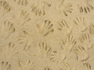 Hand prints on sand