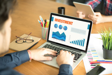 Business Charts and Graphs on screen with INVESTMENT title