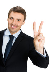 businessman showing two fingers or victory gesture