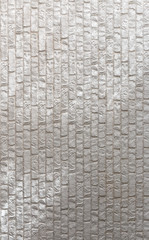 White brick wall with bright lines of light