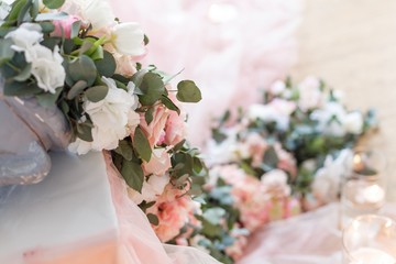 Flowers. Decoration of wedding table in ivory colors