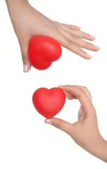 Obraz premium hands holding sweet little heart isolated on white background.