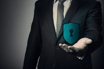 protection of personal information. Insurance data. businessman holding a shield.