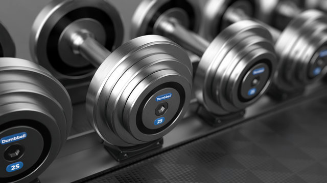Row of Dumbbell weights in the gym. 3d render