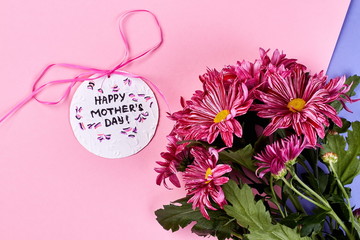 Chrysanthemums on pastel backdrop. Gift for mother from heart.