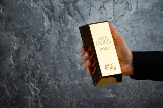 Hand With A Gold Bar