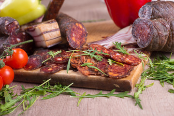 Smoked meat delicatessen on a wooden board