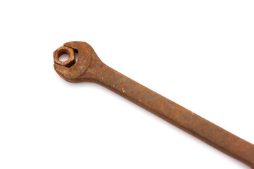 rusty nut and spanner on a white background