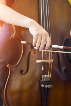 Child Playing The Cello