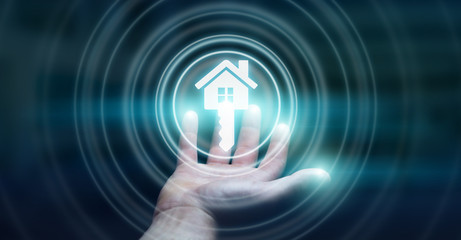 Businessman holding 3D rendering icon house in his hand