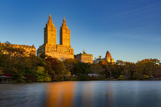 Sunrise on Upper West Side building and Central Park Lake. Manhattan, New York City