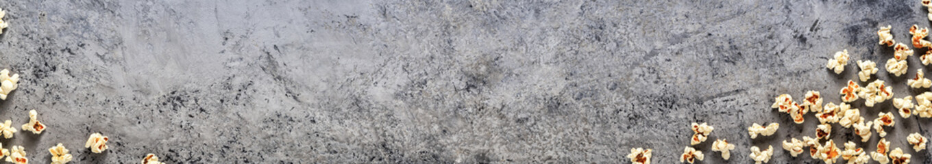 Popcorn on a concrete background, top view