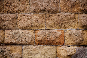 brown stone wall with a large masonry for background