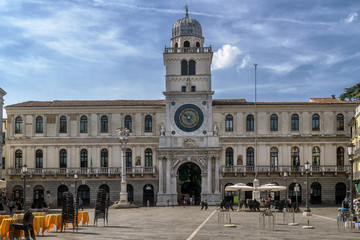Fototapeta na wymiar The beautiful clock tower in Piazza dei Signori, historic center of Padua, Veneto, Italy