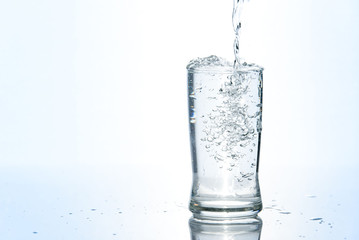 Over pouring water in glass