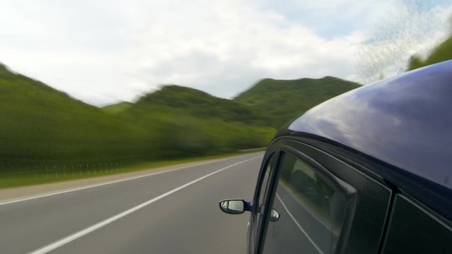 Driving on the highway in the mountains.Time lapse.