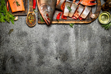 Raw fish. Cut fresh salmon with herbs and spices.