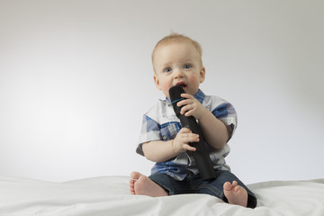 Little boy singing into microphone