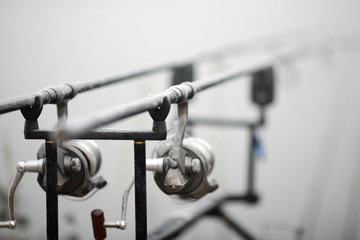 Carp fishing rods on the racks at the lake