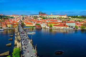 Fototapeta na wymiar Charles Bridge (Karluv Most), Prague Castle and Vltava river in Prague, Czech Republic