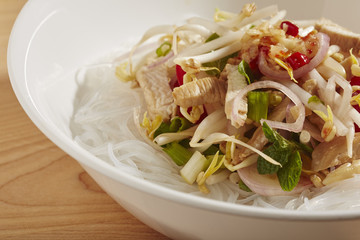 a bowl of Thai Noodle Salad made with chicken and mung bean threads