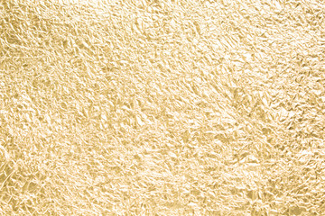 Gold wrinkled paper texture abstract background