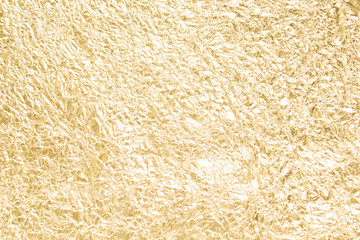 Gold wrinkled paper texture abstract background