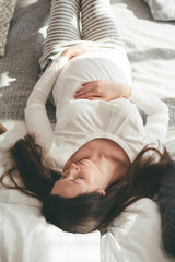 Obraz na płótnie Canvas Pregnant woman in bed in the morning