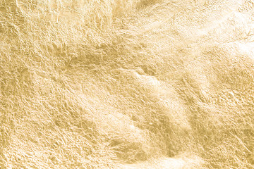 Gold wrinkled paper texture abstract background