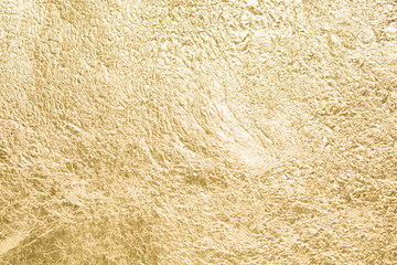 Gold wrinkled paper texture abstract background