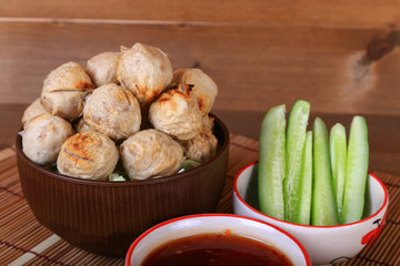 grilled meatball with spicy tamarind sauce  in bowl