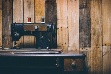 sewing machine with wooden background