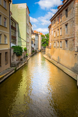 Fototapeta na wymiar Romantic Chertovka river in Prague known as Little Prague Venice