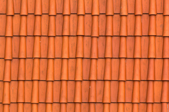 Orange ceramic roof background. Closeup texture detail.