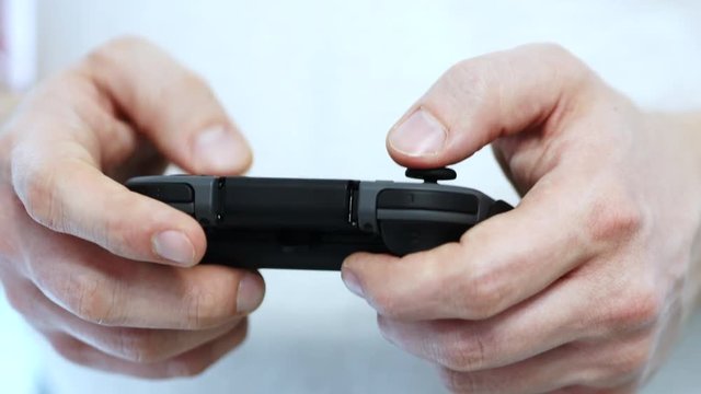 Video Gamer Holding A Controller And Playing Video Games