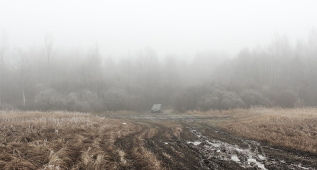 Obraz na płótnie Canvas Broken road in misty forest.