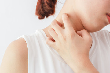 Women scratch the itch with hand /neck itching/ Concept with Healthcare And Medicine.