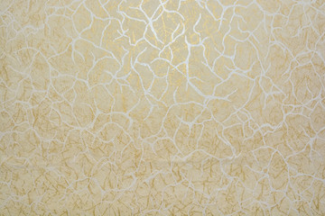 Closeup surface of wall with beige pattern