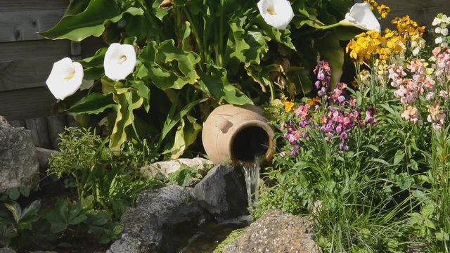 small waterfall feature in a garden
