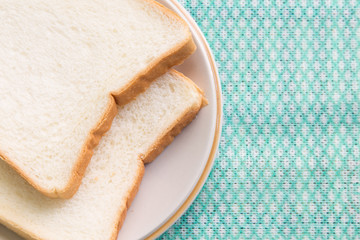 Fototapeta na wymiar Sliced bread in plate on table.