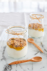 yogurt with cereal for breakfast. concept of healthy eating