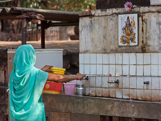 Worshipper at a water source for the use of devotees located near the entrance to the Matangesvara...