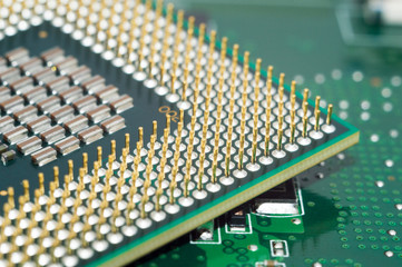 A computer motherboard with half of CPU High technology close up