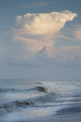 Dreamy Ocean Waves with Clouds in Shades of Blue