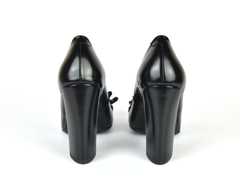 Black elegant leather high heel loafer shoes on white