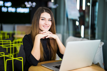 Working woman at smart space in modern office on laptop
