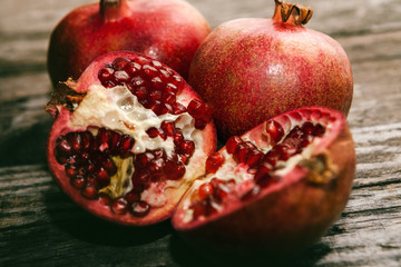 Sliced pomegranate and raw pomegranate